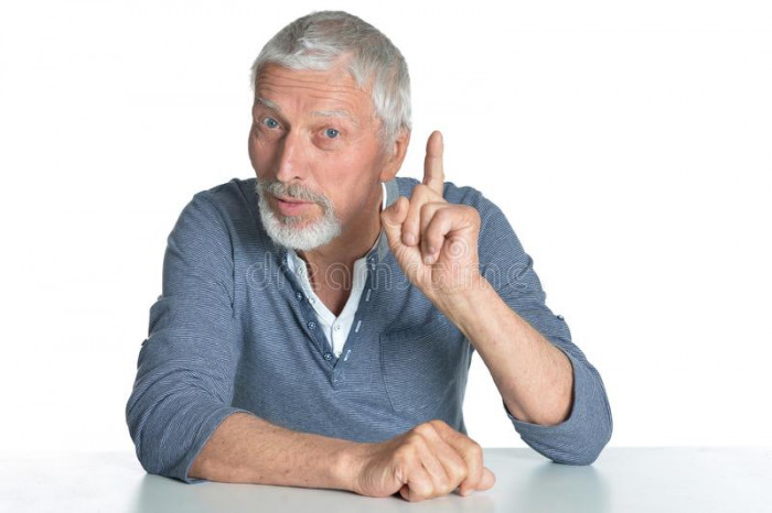 portrait-senior-man-sitting-table-pointing-up-finger-isolated-white-background-150778626[1].jpg