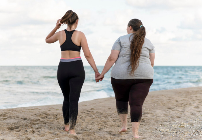 full-shot-friends-holding-hands-beach_23-2148657813.jpg